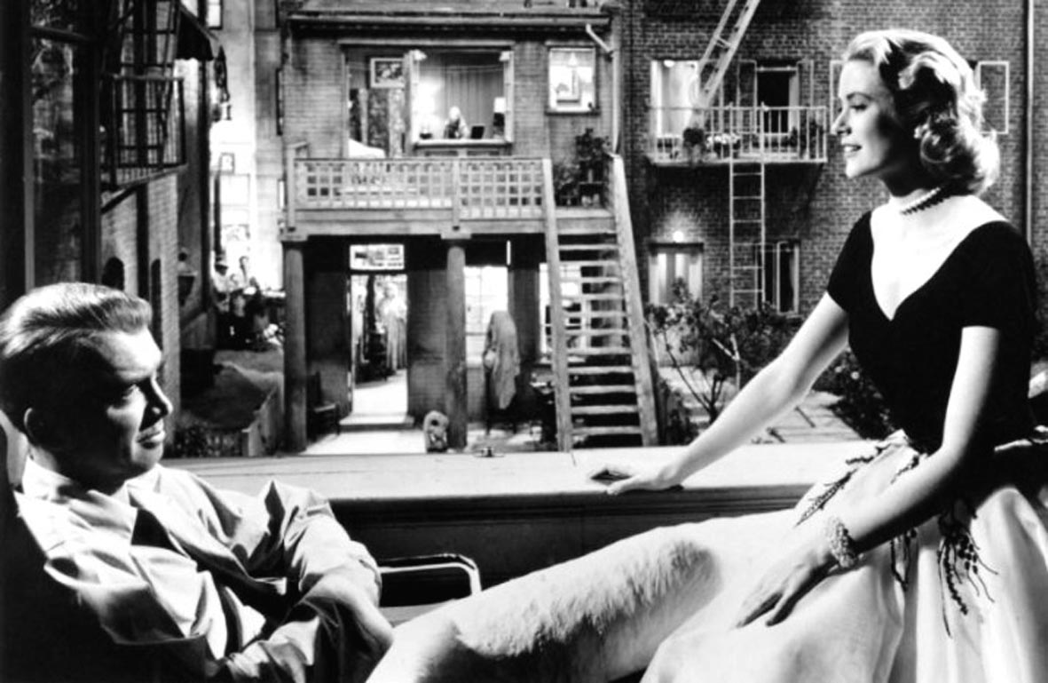 James Stewart, Grace Kelly, and Alfred Hitchcock on the set of REAR WINDOW, 1954