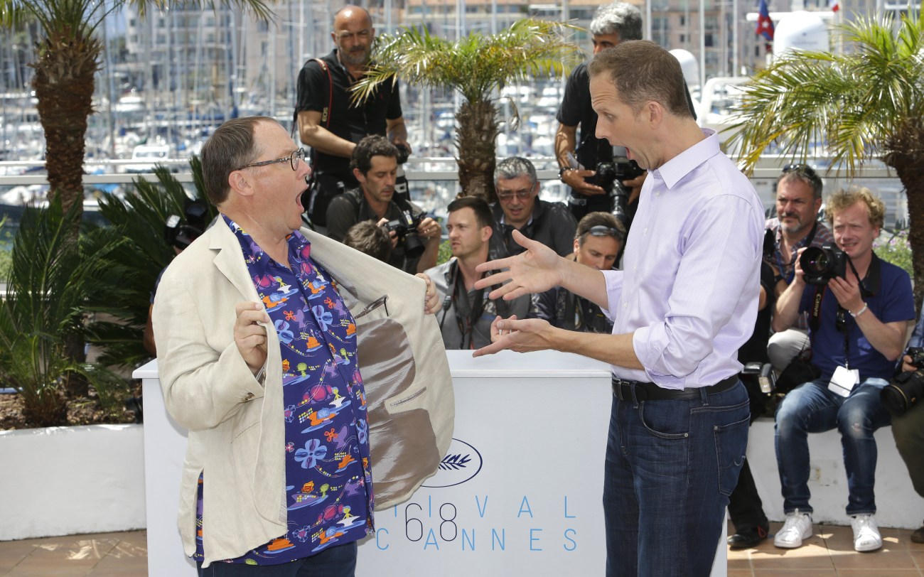 Chief creative officer of Pixar John Lasseter and director Pete Docter pose during a photo call for the film Inside Out, at the 68th international film festival, Cannes, southern France, Monday, May 18, 2015. (AP Photo/Lionel Cironneau)