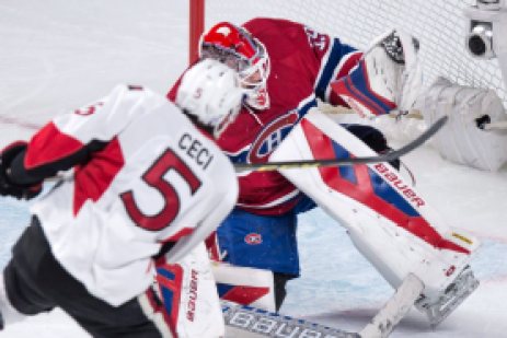 Montreal Canadiens goalie Mike Condon gloves a shot off Ottawa Senators' Cody Ceci for the save during first period NHL hockey action Tuesday, November 3, 2015 in Montreal. THE CANADIAN PRESS/Paul Chiasson