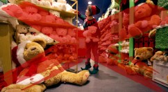 LONDON - DECEMBER 18: A sales assistant, dressed as an elf, in the Hamleys toy store on Regent Street examines the teddy bears on December 18, 2008 in London, England. Staff at Hamleys are preparing for their busiest week of the year in the final few shopping days before Christmas. Hamleys Regent Street toy shop is one of the largest in the world and the firm has been trading in London since 1760. (Photo by Oli Scarff/Getty Images)