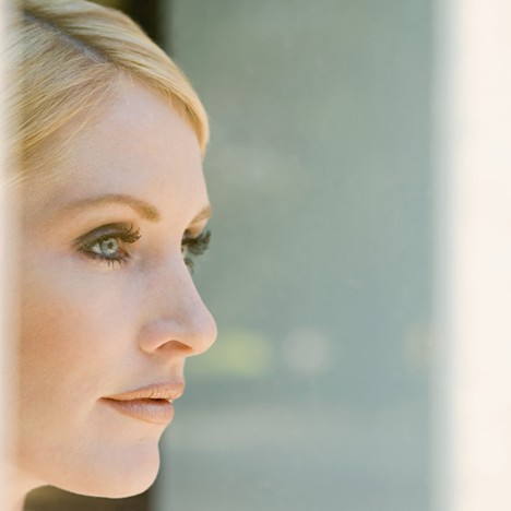 Woman looking at her reflection