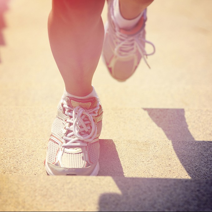 woman running at mountain stairs