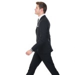 Side View Of Confident Businessman Walking