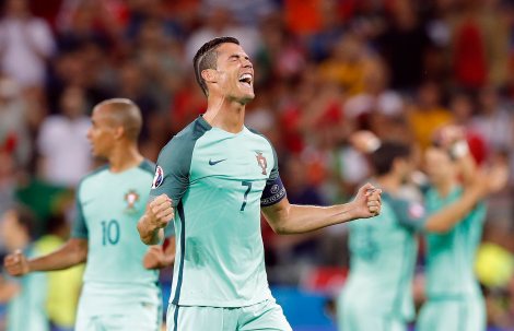 Portugal's Cristiano Ronaldo celebrates at the end of the Euro 2016 semifinal soccer match between Portugal and Wales, at the Grand Stade in Decines-­Charpieu, near Lyon, France, Wednesday, July 6, 2016. Portugal won the match 2-0. (AP Photo/Laurent Cipriani)