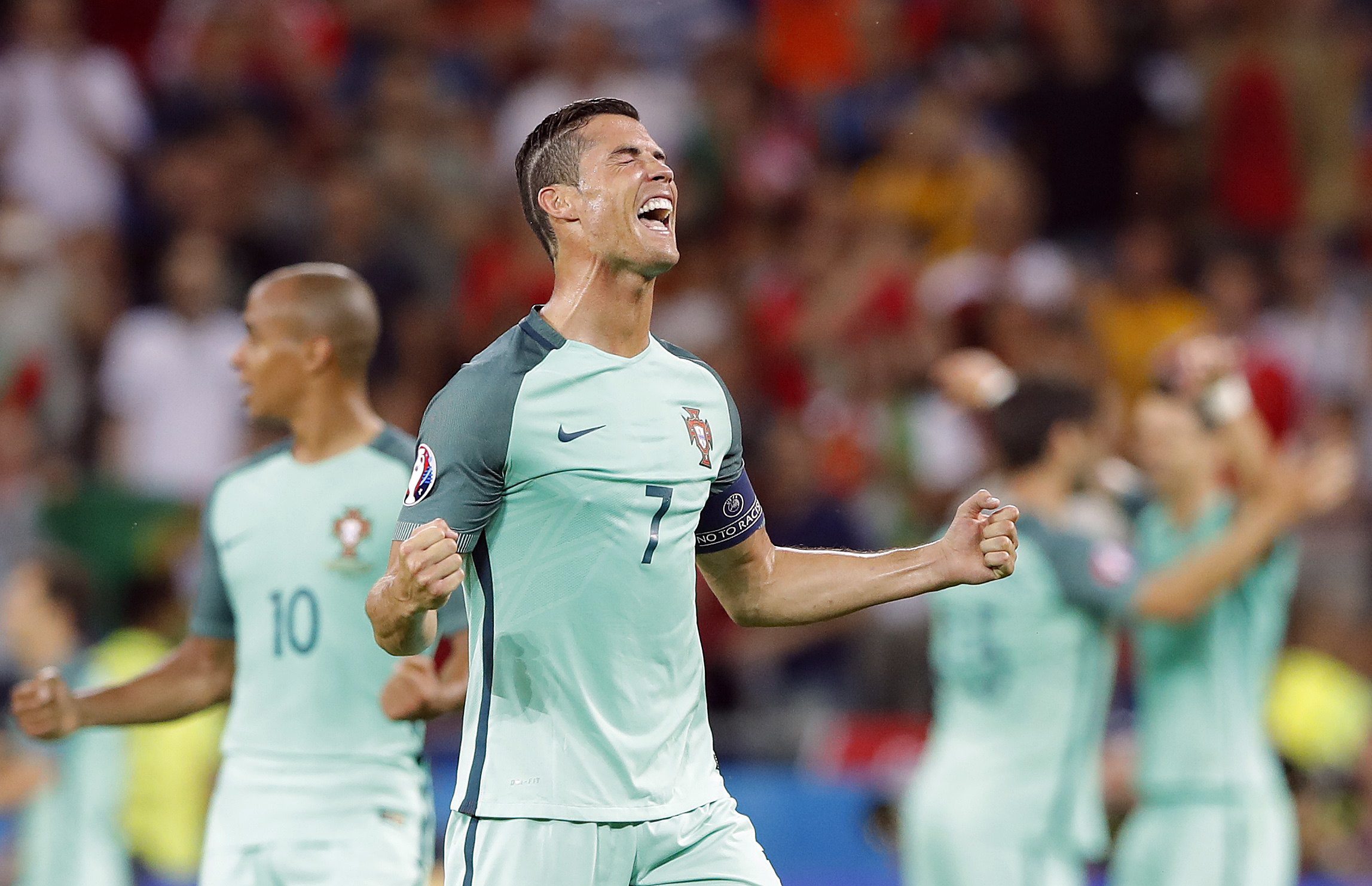 Portugal's Cristiano Ronaldo celebrates at the end of the Euro 2016 semifinal soccer match between Portugal and Wales, at the Grand Stade in Decines-Charpieu, near Lyon, France, Wednesday, July 6, 2016. Portugal won the match 2-0. (AP Photo/Laurent Cipriani)