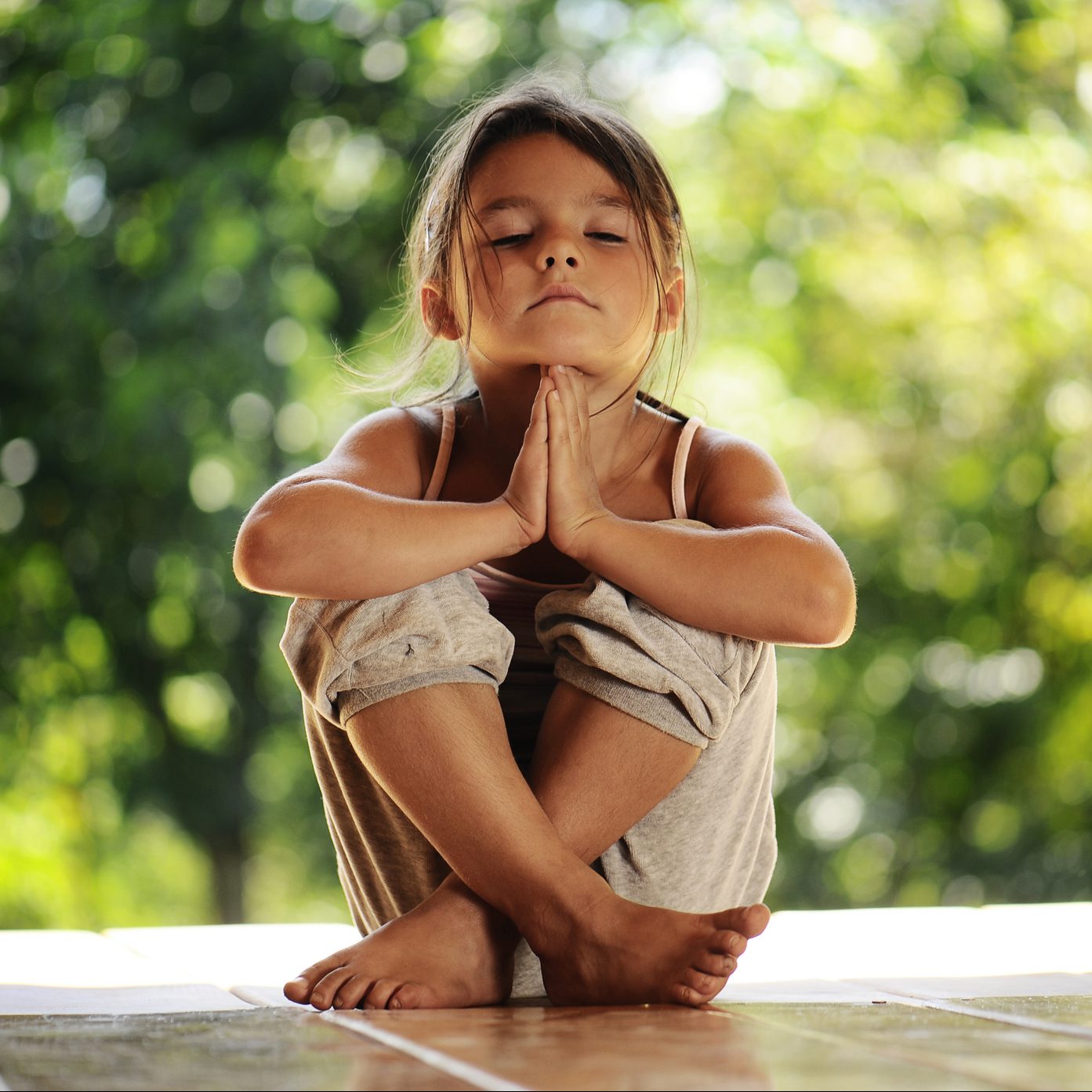 girl on meditation in the morning park