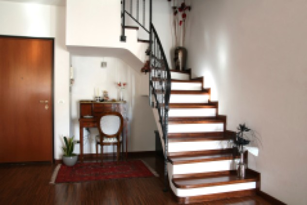 Interior decoration of a room with stairs and antique desk