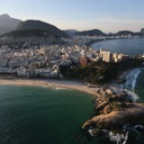 RIO DE JANEIRO, BRAZIL - JULY 04: Ipanema beach (L), Arpoador rock (BOTTOM) and Copacabana Beach (TOP C), one of the Olympic venue locations, stand on July 4, 2016 in Rio de Janeiro, Brazil. July 5 marks the one-month mark to the beginning of the Rio 2016 Olympic Games with an economic crisis, political turmoil and Zika virus fears roiling the country. (Photo by Mario Tama/Getty Images)