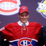 BUFFALO, NY - JUNE 24: Mikhail Sergachev celebrates with the Montreal Canadiens after being selected ninth overall during round one of the 2016 NHL Draft on June 24, 2016 in Buffalo, New York. (Photo by Bruce Bennett/Getty Images)