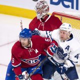 Montreal Canadiens defenseman Shea Weber keeps Toronto Maple Leafs' Leo Komarov away from goaltender Carey Price during first period NHL pre-season hockey action Thursday, October 6, 2016 in Montreal. THE CANADIAN PRESS/Paul Chiasson
