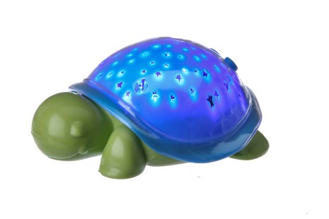The SuperMax the Turtle nightlight, inspired by Max Wilford, an 8-year-old boy with brain cancer, in New York, Sept. 16, 2015. Like its larger predecessor, Cloud b’s Twilight Turtle, SuperMax projects a starry night sky on the walls and ceiling of a room, helping to ease fear of the dark. (Tony Cenicola/The New York Times)