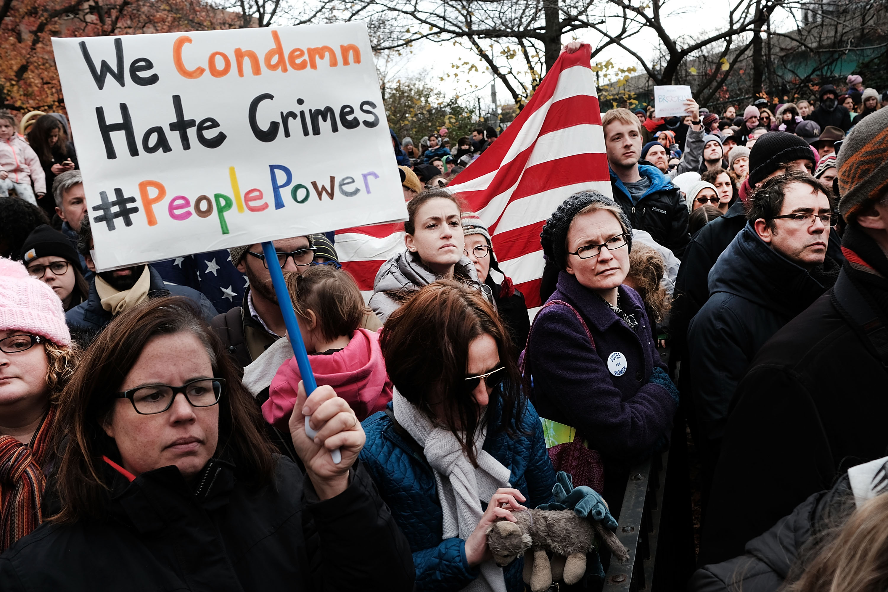 NEW YORK, NY - NOVEMBER 20: People participate in an anti-hate rally at a Brooklyn park named in memory of Beastie Boys band member Adam Yauch after it was defaced with swastikas on November 20, 2016 in New York City. On Friday, the park and playground was spray painted with swastikas and the message "Go Trump". Hundreds of people, many with their children, listened to community leaders and Beastie Boys member Adam Horovitz condemn racism and intolerance. Following the election of Donald Trump as president, there has been a surge of incidents of racist activities reported. (Photo by Spencer Platt/Getty Images)