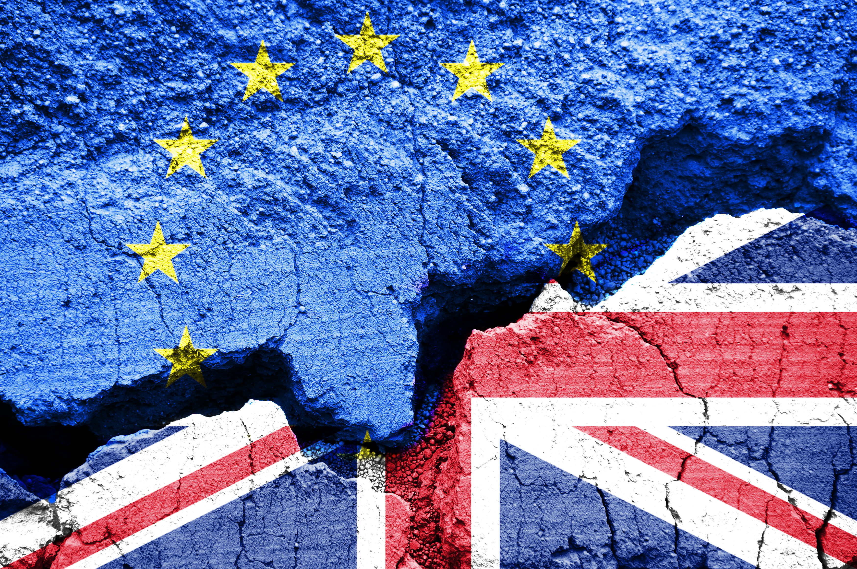 Brexit, Flags of the United Kingdom and the European Union on cracked background