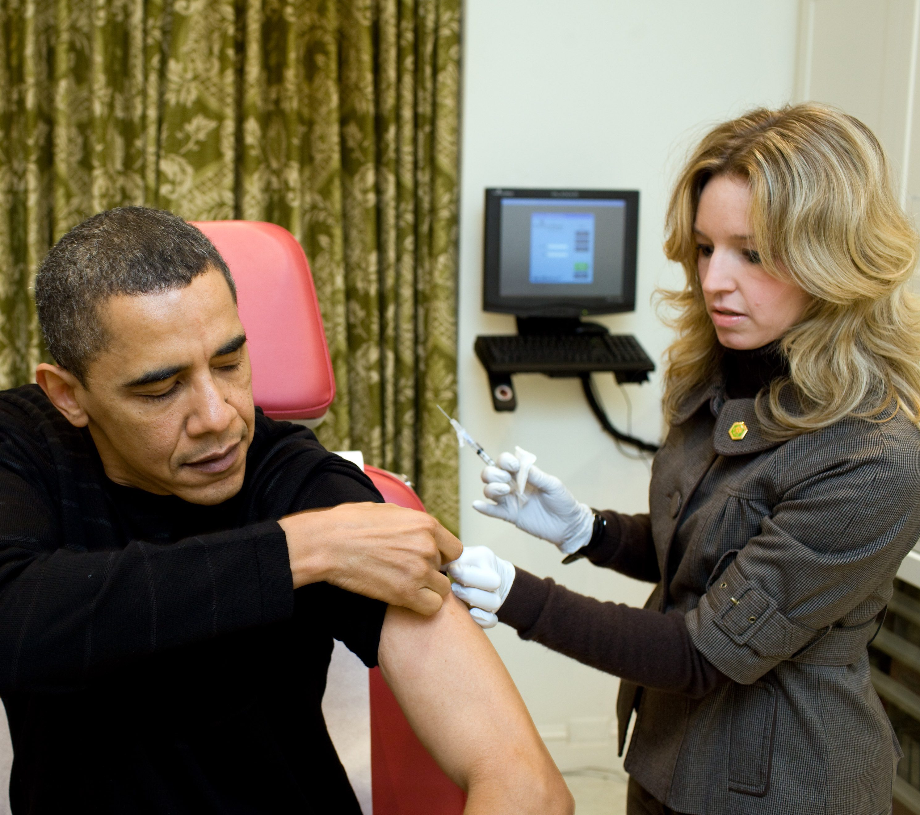 WASHINGTON - DECEMBER 20: In this handout provided by the White House, A White House nurse prepares to administer the H1N1 vaccine to President Barack Obama at the White House on December 20, 2009 in Washington, DC. The Senate passed the first of three crucial procedural votes on health care by a 60 to 40 margin the following day on December 21, 2009 in Washington, DC. (Photo by Pete Souza/White House via Getty Images)