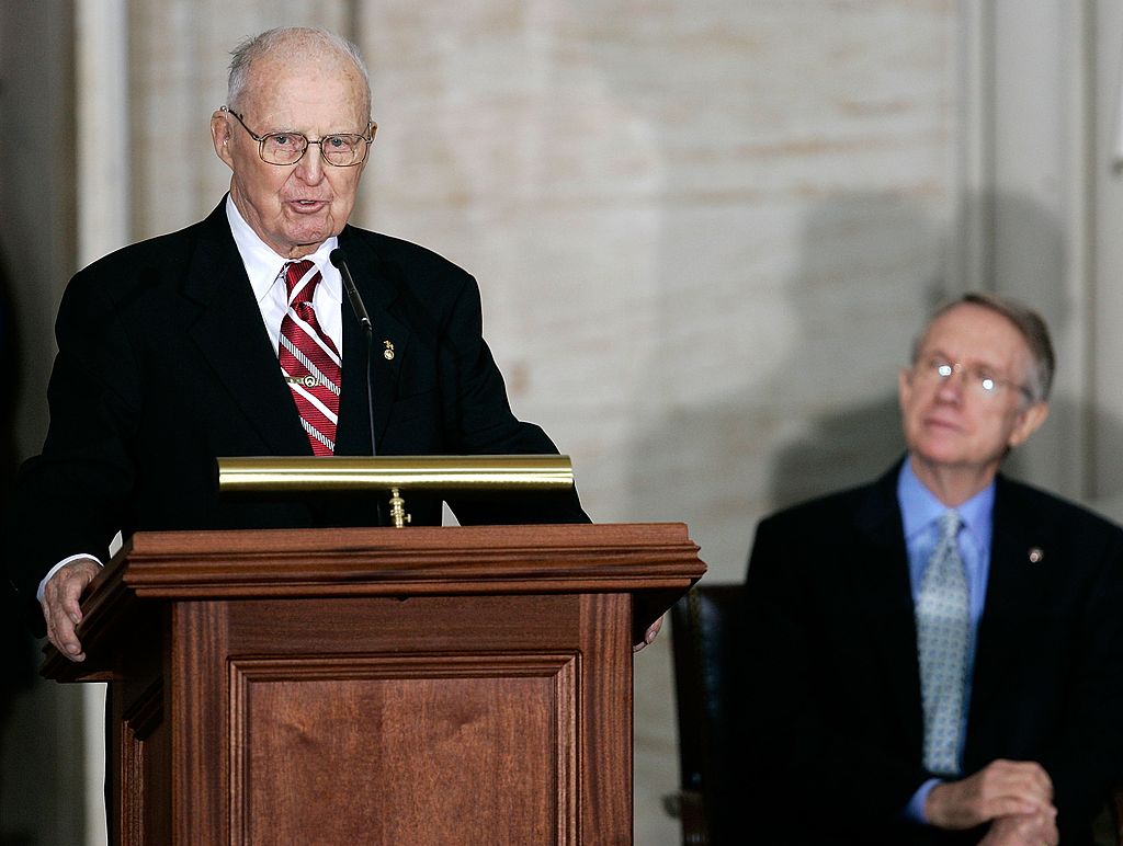 WASHINGTON - JULY 17:  Agricultural scientist Norman E. Borlaug speaks as U.S. Senate Majority Leader Sen. Harry Reid (D-NV) looks on during a Congressional Gold Medal presentation ceremony July 17, 2007 on Capitol Hill in Washington, DC. Borlaug, a 1970 Nobel Peace Prize recipient, was awarded the medal for his work on developing a strand of disease-resistant wheat, in turn increasing food supply throughout the world.  (Photo by Alex Wong/Getty Images)