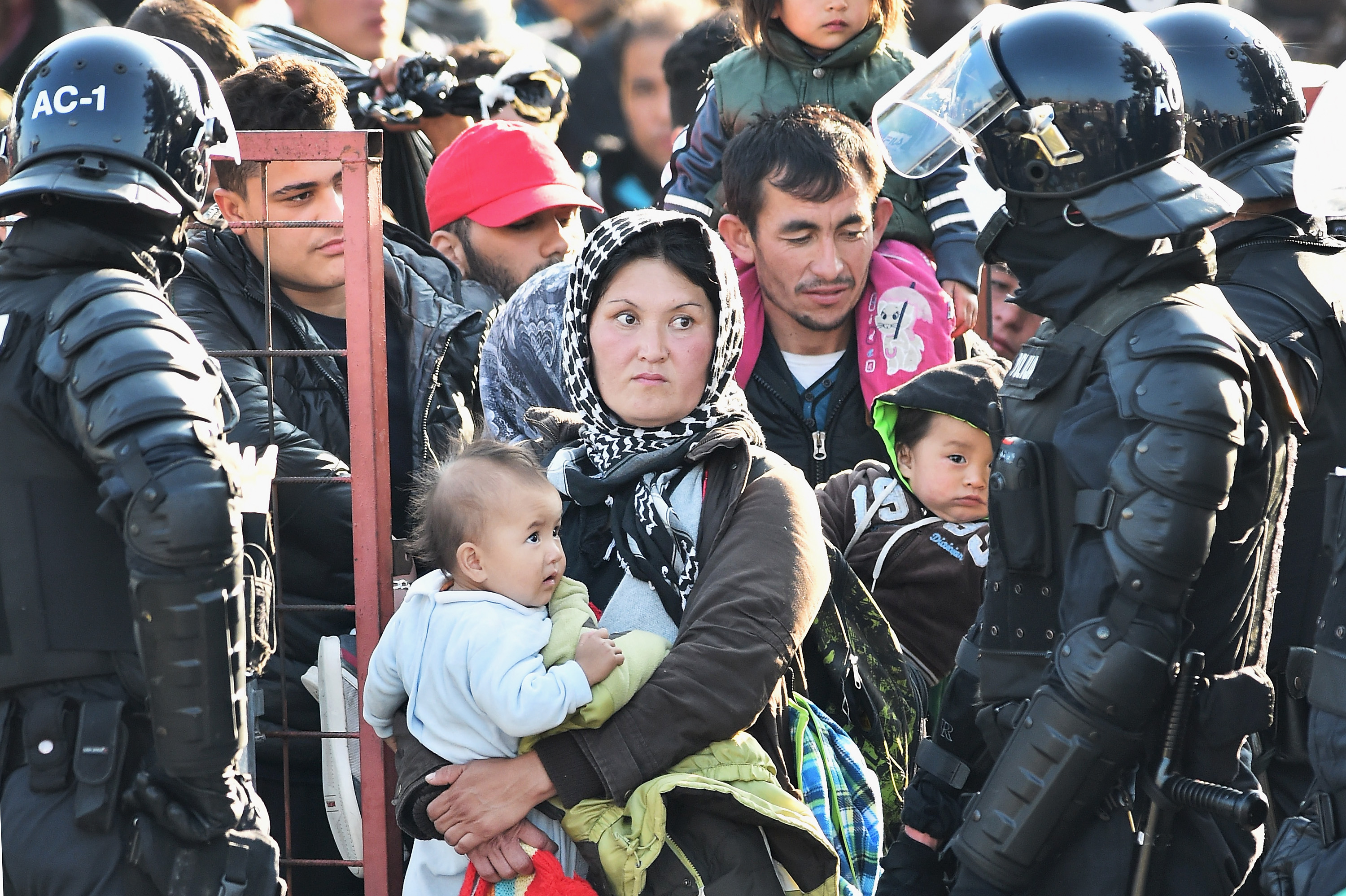DOBOVA, SLOVENIA - OCTOBER 26: Migrants are held at a holding camp in the village of Dobova before boarding a train heading towards Austria on October 26, 2015 in Dobava, Slovenia. Thousands of migrants marched across the border between Croatia into Slovenia as authorities intensify their efforts to attempt to cope with Europe's largest migration of people since World War II. (Photo by Jeff J Mitchell/Getty Images)
