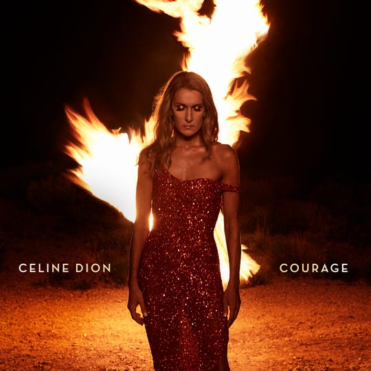 Couverture de l'album &laquo;Courage&raquo; de C&eacute;line Dion, montrant la chanteuse en robe devant une flamme.