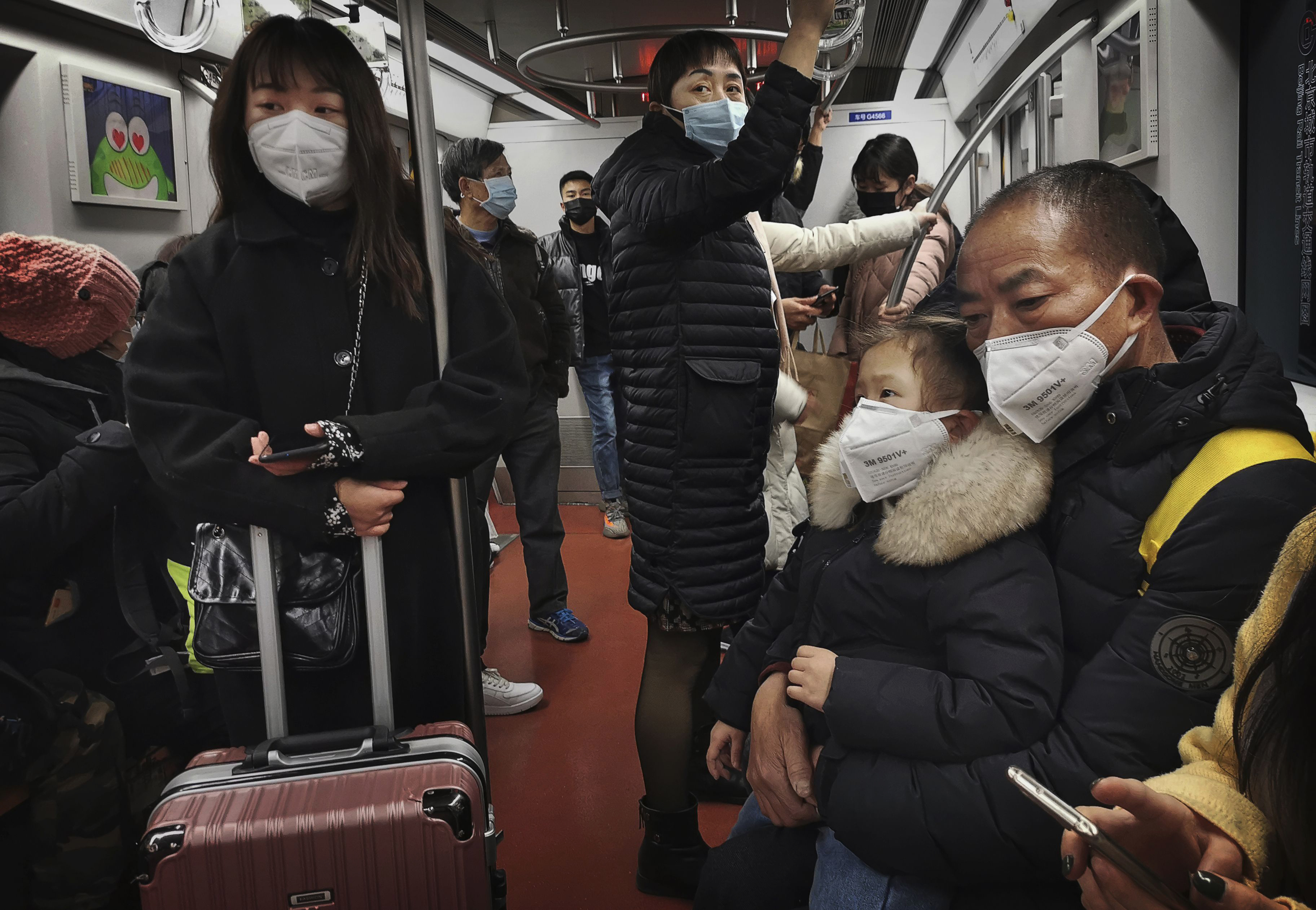 Des passagers du métro de Pékin