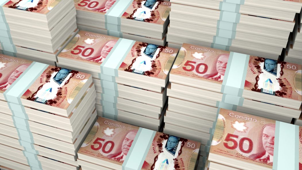 Des liasses de billets de 50$ représentant l'économie du Québec