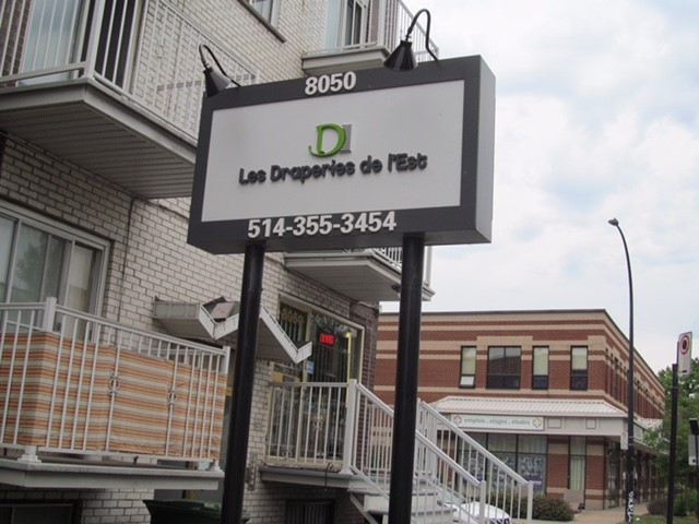 Un panneau du commerce L'entreprise Les Draperies de l'Est sur la rue Hochelaga