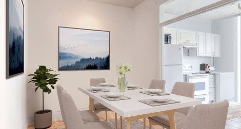 La salle de s&eacute;jour d'un des logements du triplex rose.