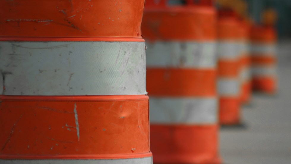 A lane blocked off by orange cones.