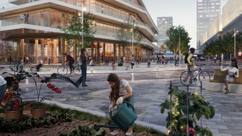 Maquette du futur écoquartier Carré Laval, montrant des gens se promenant dans les rues.